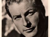 an old black and white photo of a man in a suit and tie