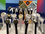 a lot of watches that are on display on a table
