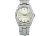 une photo d'une montre-bracelet avec un cadran blanc et un bracelet argenté