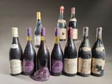 several bottles of wine sitting on top of a table next to each other