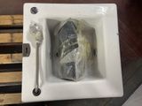 a fish in a bowl with a spoon and fork in it
