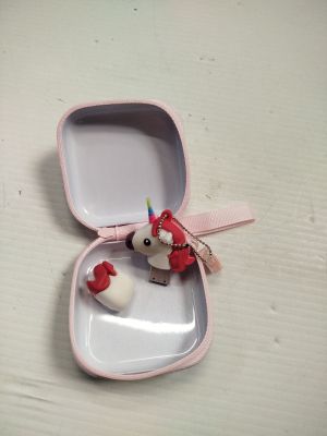 a small pink box with a small red bird in it