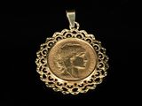 a close up of a gold coin with a woman ' s face on it