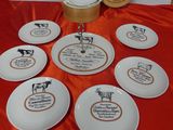 several plates with different types of food on them on a table