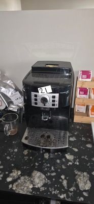 a coffee machine sitting on a counter in a kitchen