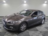 a picture of a gray mazda mazda car in a showroom