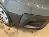 the front end of a car with a denting dent on it