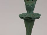 statue of a woman in a tutu on a marble base