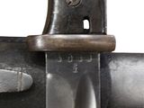 a close up of a knife on a metal pole