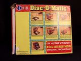 a box with a picture of a disc - o - matic on it