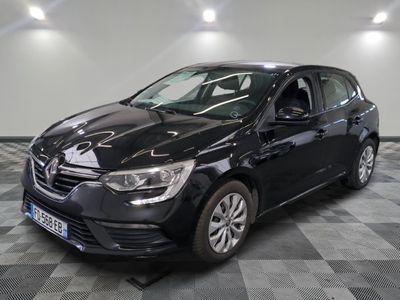 the black car is parked on a checkered floor in the garage