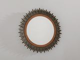 un miroir rond accroché au mur d'une pièce