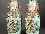 pair of chinese vases with birds and flowers on them
