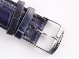blue leather belt with silver buckle on a white surface