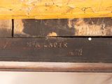 a close up of a piece of wood that has been painted yellow