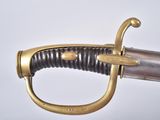 an old sword with a gold handle on a white background