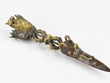 a small metal object with a bird on top of it