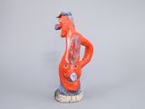 a figurine of a man with a guitar in his hand