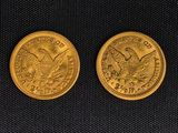 two gold coins, one of which has a eagle and the other of which is a bird