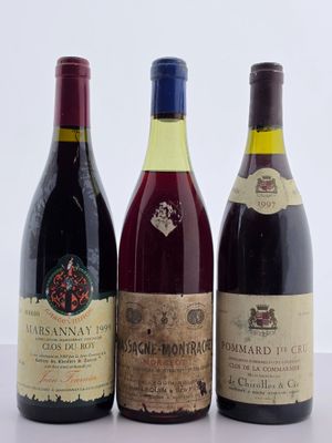 trois bouteilles de vin sont alignées sur une table