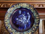 a blue plate with a picture of a man and a woman on it