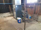 a water heater that is in the middle of a room