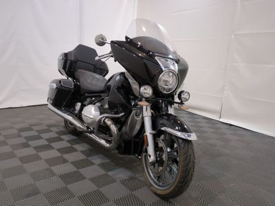 a motorcycle that is parked in a room with a checkered floor