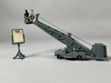 a toy truck with a crane attached to the back of it
