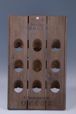 wooden wine rack with six bottles of wine on top of it