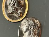 two coins that are sitting next to each other on a table