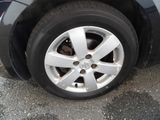 a close up of a car ' s tire on the road