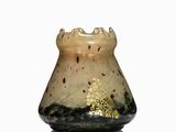 a small glass vase with a gold leaf design on it