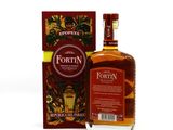 the bottle of fortin is next to a box of liquor