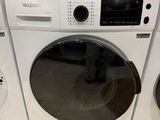 a stack of washers and dryers sitting on the floor