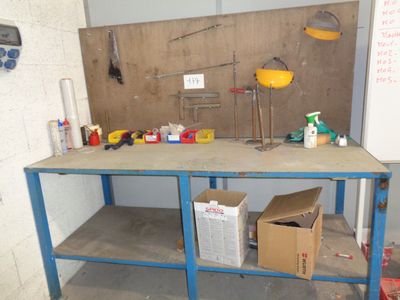 an image of a workbench with a lot of tools on it