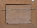 an old picture frame with barbed wire hanging on a wall