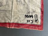 a piece of cloth with writing on it on a table