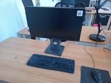 an image of a desk with a computer monitor and keyboard