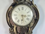 a clock that is hanging on the wall in the room