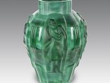 an image of a green vase sitting on top of a table