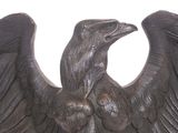 a statue of an eagle that is sitting on a table