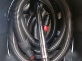 a close up of a vacuum cleaner with a hose in it