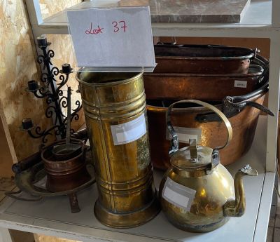a shelf that has a lot of antique items on it