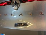 the back end of a silver car with the word arkan on it
