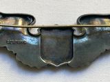 an image of a close up of a metal object on a white surface