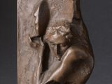 a statue of a woman holding a knife in her hands