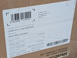 a cardboard box with a barcode on it sitting on the ground
