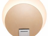 a close up of a light that is on a wall