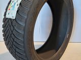 a close up of a tire on a white surface