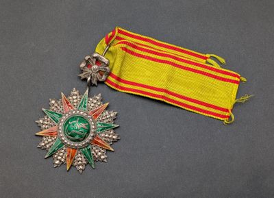 a close up of a medal and a ribbon on a table